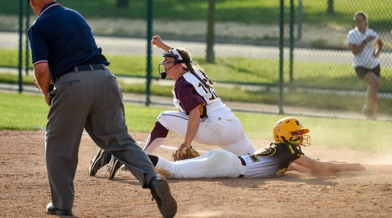 Ross first baseman Kelsey Warman celebrates an out on Springfield Kenton Ridge’s Madison Hall on a double-play throw from center fielder Ashley Parrett during the Rams’ 2-1 victory in a Division II regional semifinal May 25, 2016, at Mason. NICK GRAHAM/STAFF
