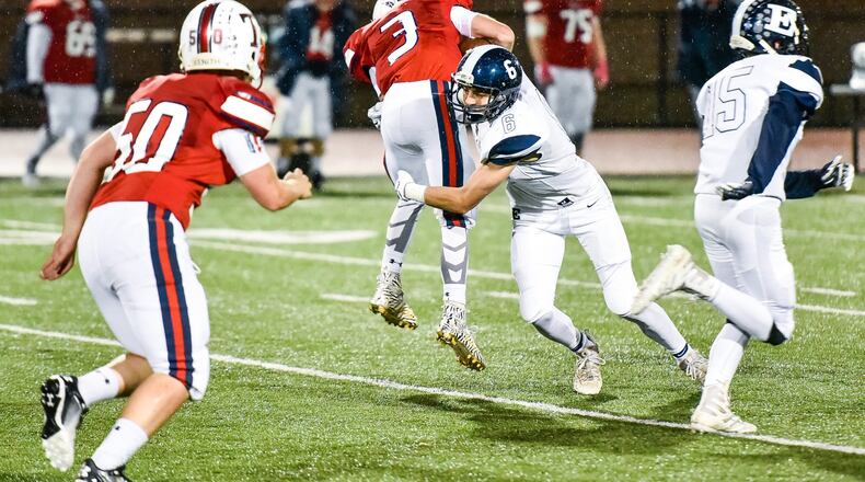 Talawanda’s Tyler Prater is tackled by Edgewood’s Logan Loftus during Friday night’s game at Talawanda Field in Oxford. NICK GRAHAM/STAFF