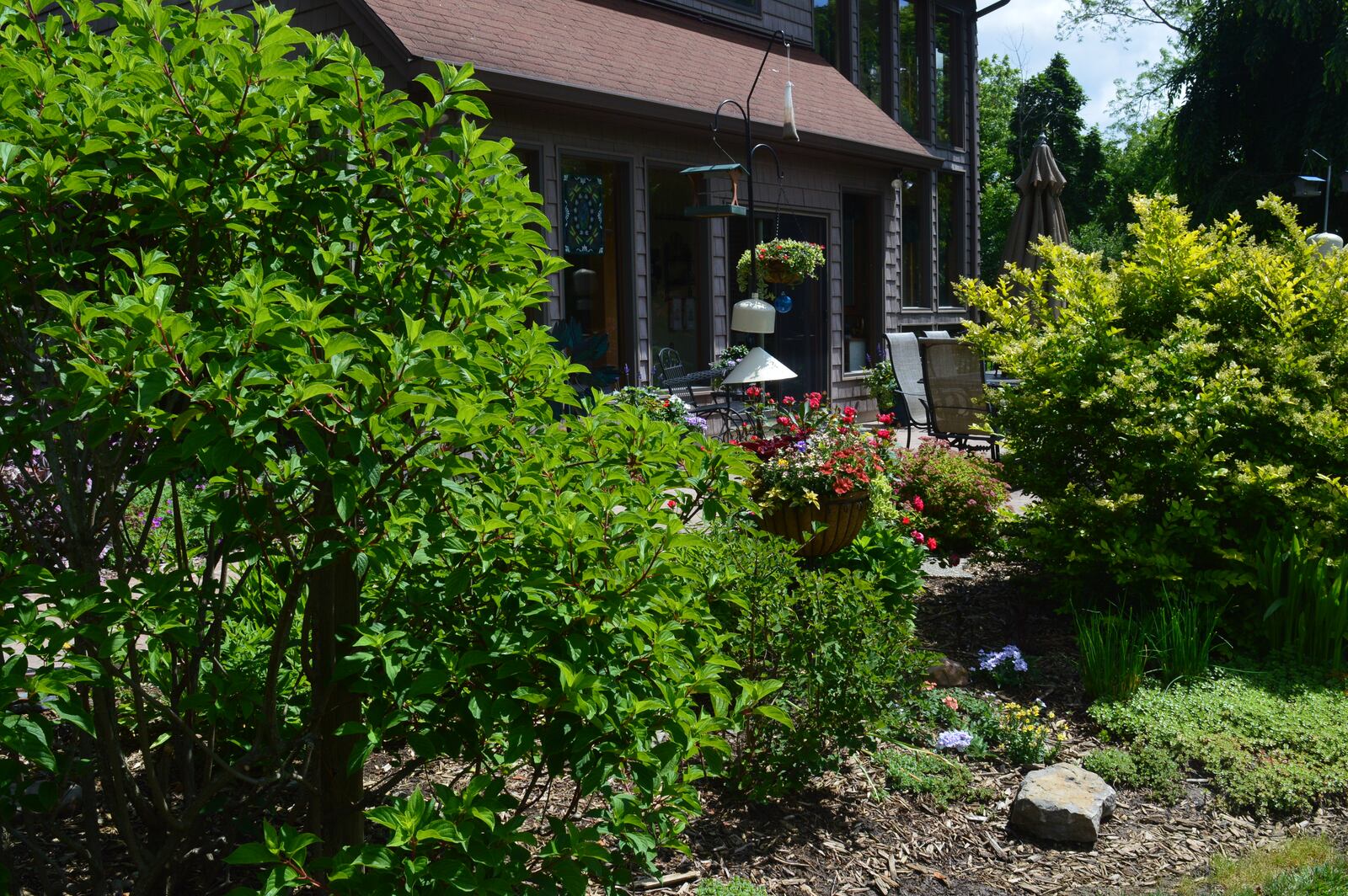 A colorful patio garden offers a quiet spot for Gwen and Ed Pietzuch to relax while looking out over their gardens spread around their property. CONTRIBUTED/BOB RATTERMAN