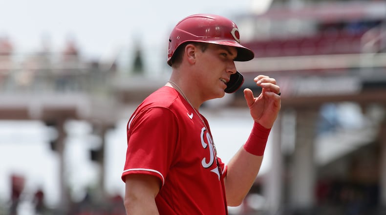 Tyler Stephenson, of the Reds, stands on third after driving in three runs against the Brewers in the second inning on Wednesday, May 11, 2022, at Great American Ball Park in Cincinnati. David Jablonski/Staff