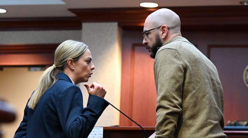 Former Lakota teacher Justin Daniel Dennis speaks with his attorney, Chelsea Panzeca, during an October 2025 court hearing before Butler County Common Pleas Judge Keith Spaeth. Dennis pleaded guilty Wednesday, Jan. 28, 2026, to three counts of sexual battery, all third-degree felonies. Five counts of the same were dismissed by the court. Dennis had an inappropriate relationship with a student when she was 17 during the 2021-2022 school year. STAFF FILE PHOTO