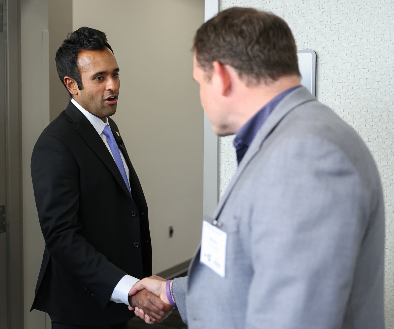 Ohio gubernatorial candidate Vivek Ramaswamy shakes hands with Adam Murka of Fidelity Strategies following the keynote address in the Ohio Chamber's 2025 Dayton Regional Impact Ohio Conference on Tuesday, Aug. 26, in the Apollo Room in the Student Union at Wright State University. BRYANT BILLING / STAFF