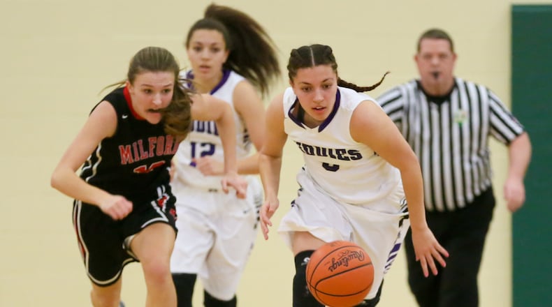 Middletown guard Alexis Shealey (5) leads a fast break during a Division I sectional girls basketball game agianst Milford at Sycamore on Feb. 13, 2016. GREG LYNCH/STAFF
