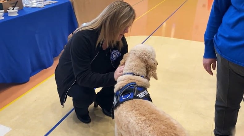 Tango, the newest therapy dog for the Hamilton City Schools, is being used to help de‑escalate children who might be overstimulated in stressful situations. The nearly 2-year-old doodle mix and a previous therapy dog, Arrow, will be joined by three new therapy dogs next school year thanks to a Hamilton Community Foundation grant. CONTRIBUTED