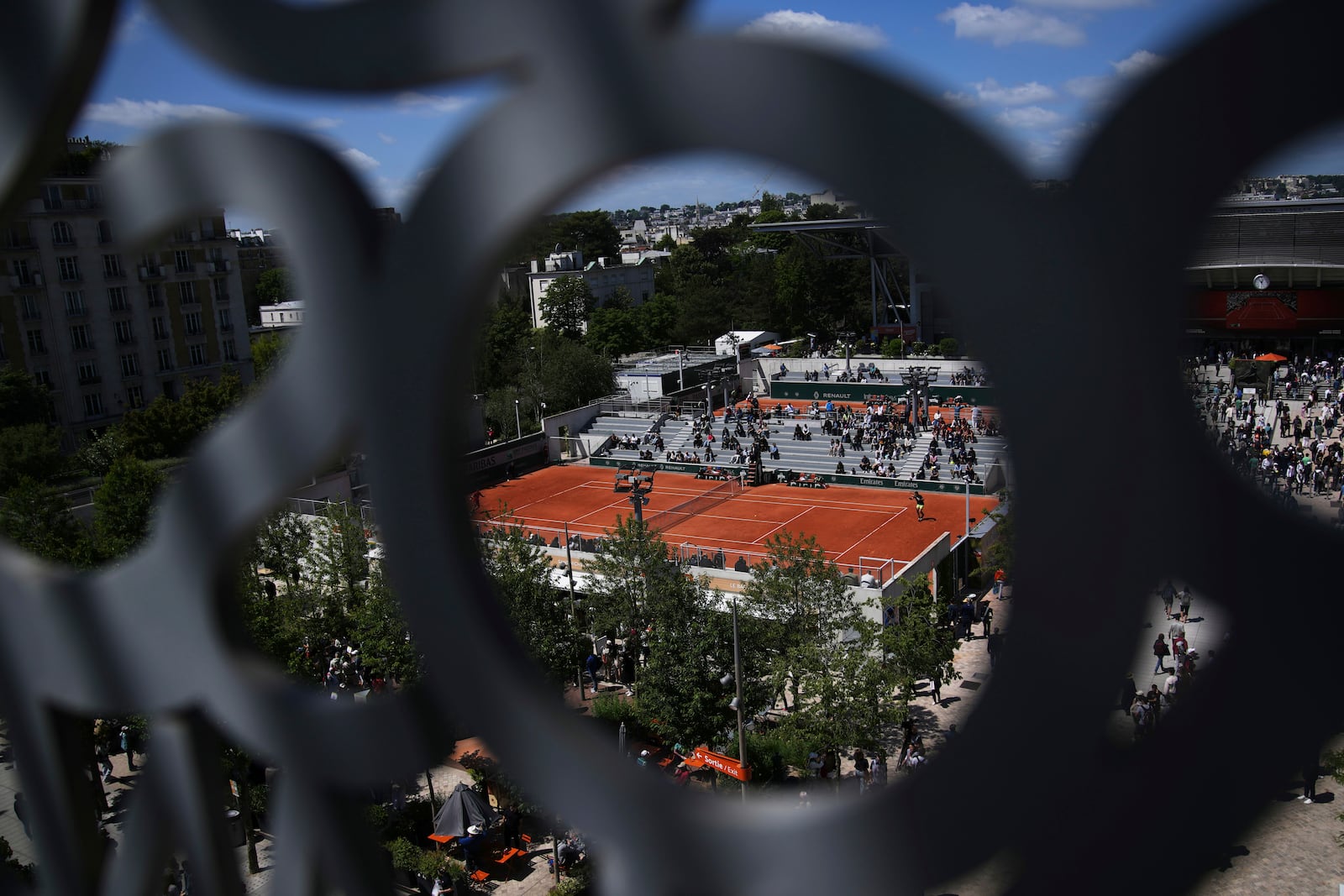 Visitors watch matchs before the draw of French Open tennis tournament Thursday, May 22, 2025 at the Roland Garros stadium in Paris. (AP Photo/Christophe Ena)