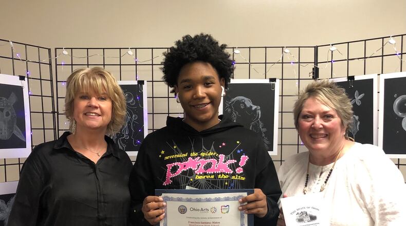 For the first time the artwork created by a student at Middletown High School will hang in a featured gallery at Ohio’s Statehouse in Columbus.
Francisco Santana-Matos painting was recently selected by the Ohio Arts Council to be featured in the Ohio House of Representatives High School Student Art Exhibition. Middletown High School Art Teacher Trish Keen (left) shown with Francisco Santana-Matos and Middletown High School Principal Carmela Cotter is on his right. (Provided)