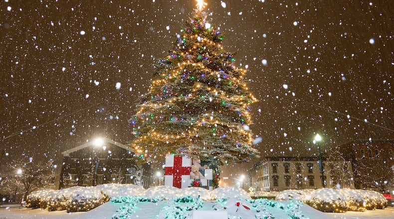 A snow storm moved through the region on Monday, Dec. 1 and blanketed area Christmas tree displays, including Troy. Miami County is expected to see between three and five inches; all of the area is expected to see at least two inches. BRYANT BILLING/STAFF