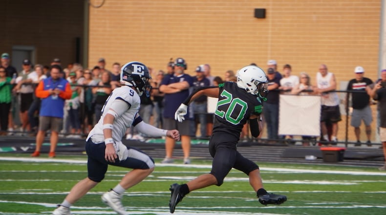 Badin's Chase Evan carries the ball and is pursued by Edgewood's Carter Breedlove during their game on Friday night at the Matandy SportsPlex. MATT VOGT / CONTRIBUTED