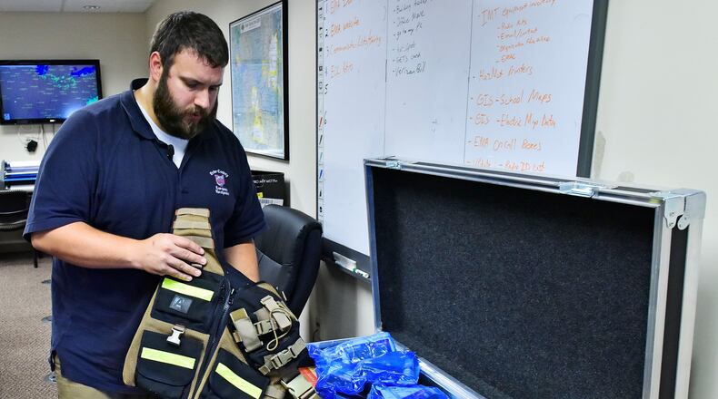 Jim Bolen with the Butler County Emergency Management Agency organized supplies last year before a crew of about 15 people traveled to Florida to assist in Hurricane Irma recovery. The Butler County EMA may be deployed to Virginia soon to help ahead of Hurricane Florence. NICK GRAHAM/STAFF