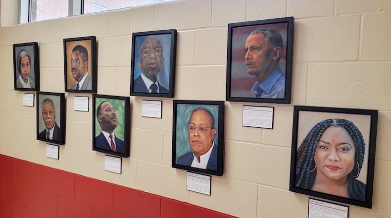 Artist John Wiehe created portraits of civil rights leaders that are displayed on the wall in Fairfield High School cafeteria. The series of paintings called "Connecting Past with Present: The Never-Ending Struggle for Civil Rights" shows 16 people ranging in time from enslavement to the Black Lives Matter movement. NICK GRAHAM / STAFF