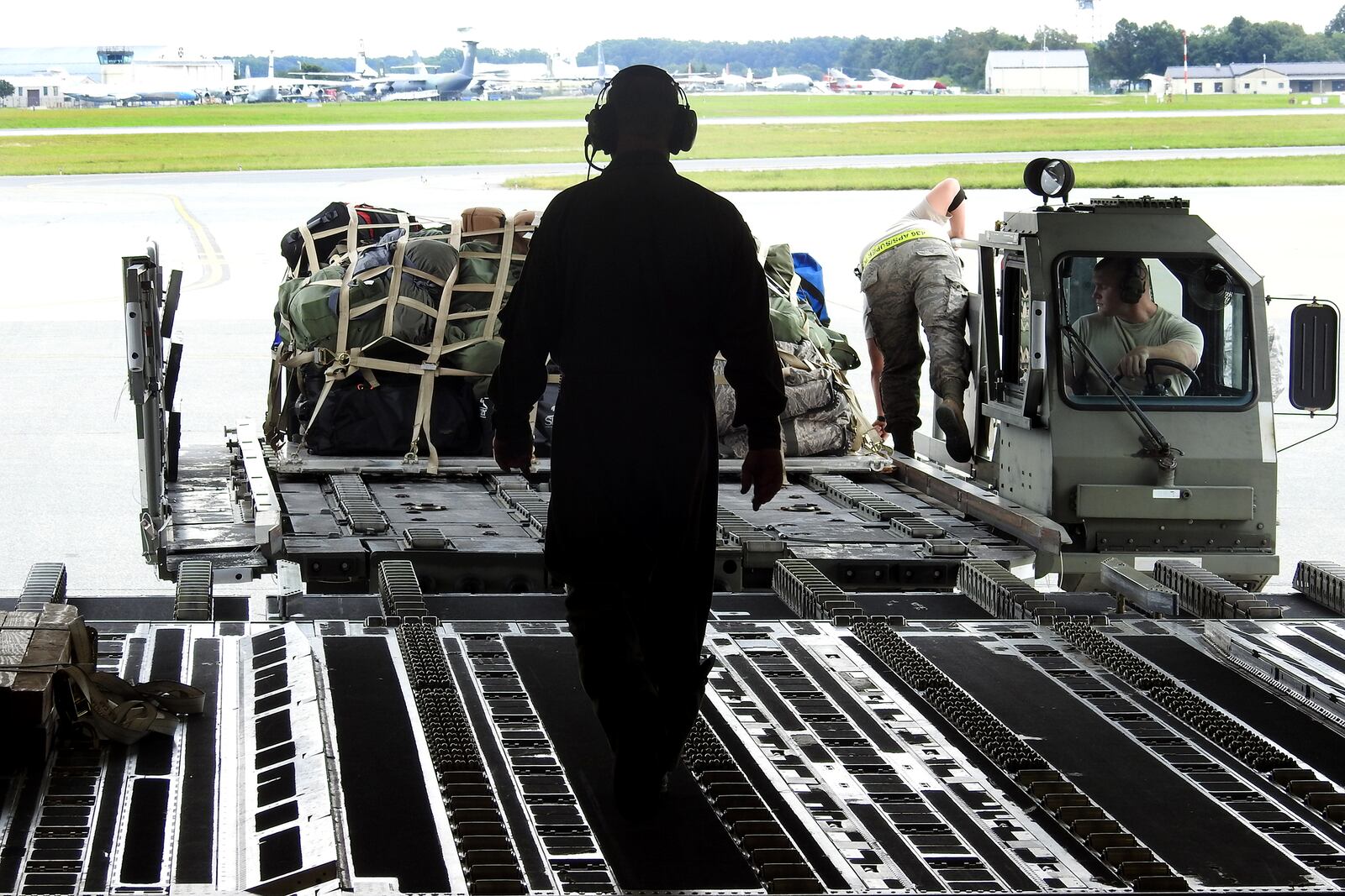 A Wright-Patterson based Air Force Reserve crew loads luggage at Joint Base McGuire-Dix-Lakehurst in New Jersey after picking up troops and supplies to deliver to Florida to assist with Hurricane Irma recovery efforts. BOB GARLOCK / STAFF