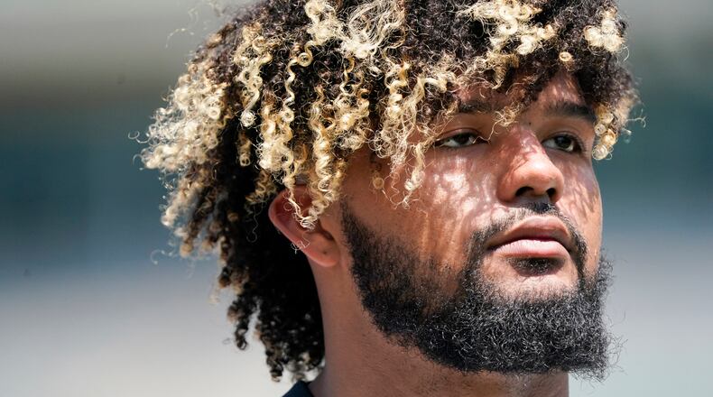 Cincinnati Bengals offensive lineman Jackson Carman takes part in drills at the team's NFL football stadium, Tuesday, June 14, 2022, in Cincinnati. (AP Photo/Jeff Dean)