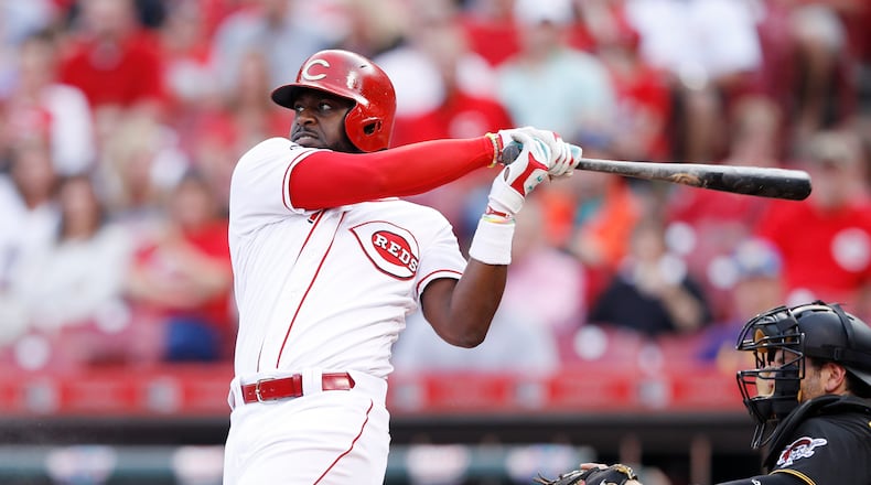 Brandon Phillips of the Cincinnati Reds drives in a run with a single to center field against the Pittsburgh Pirates in the first inning of the game at Great American Ball Park on May 11, 2016 in Cincinnati, Ohio. (Photo by Joe Robbins/Getty Images)
