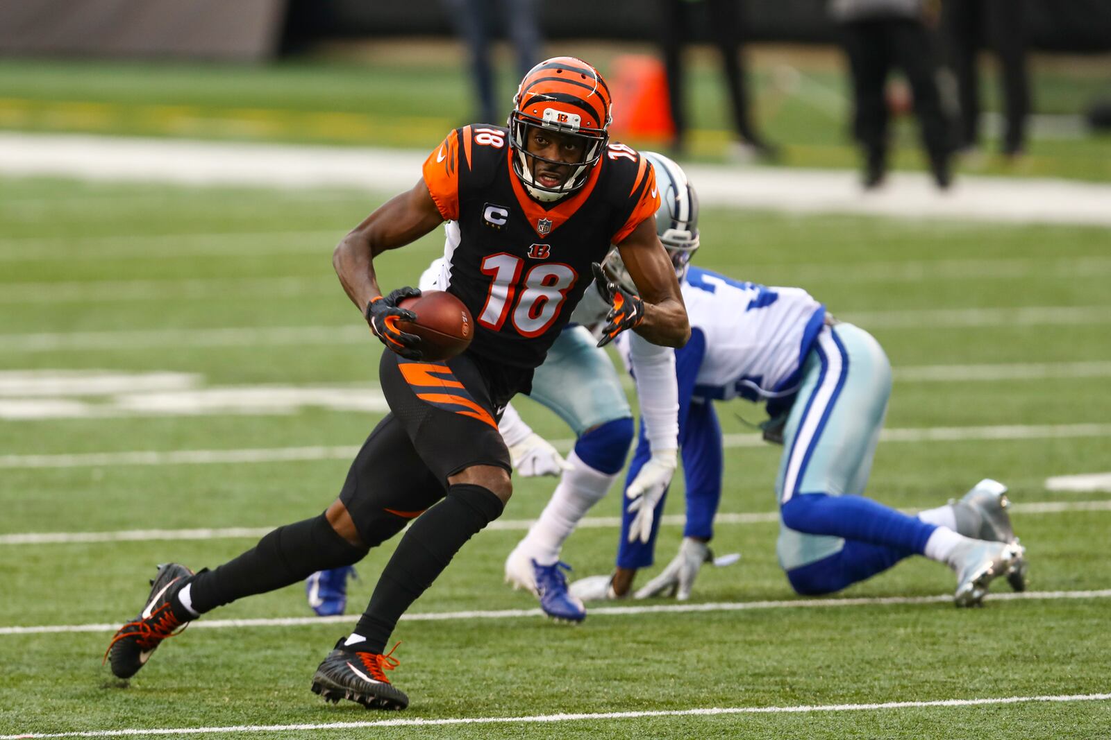 Cincinnati Bengals wide receiver A.J. Green (18) runs after a catch against the Dallas Cowboys in the first half of an NFL football game in Cincinnati, Sunday, Dec. 13, 2020. (AP Photo/Aaron Doster)