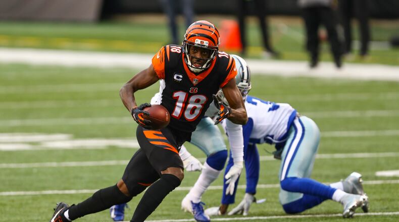 Cincinnati Bengals wide receiver A.J. Green (18) runs after a catch against the Dallas Cowboys in the first half of an NFL football game in Cincinnati, Sunday, Dec. 13, 2020. (AP Photo/Aaron Doster)