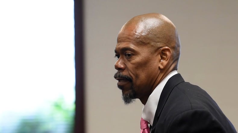 Clyde Bennett II, attorney for Liz Rogers who is charged with impersonating a police officer, appeared in court on her behalf Tuesday in the Butler County Area III Court in West Chester Twp.  NICK GRAHAM/STAFF