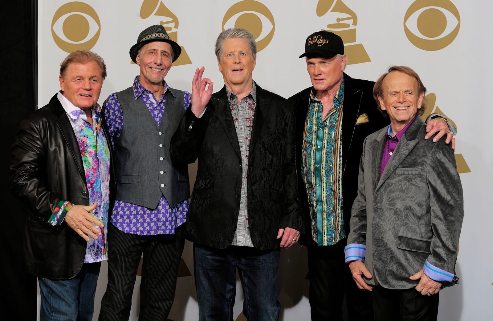 FILE - Members of The Beach Boys, from left, Bruce Johnston, David Marks, Brian Wilson, Mike Love and Al Jardine appear backstage at the 54th annual Grammy Awards in Los Angeles on Feb. 12, 2012. (AP Photo/Mark J. Terrill, File)
