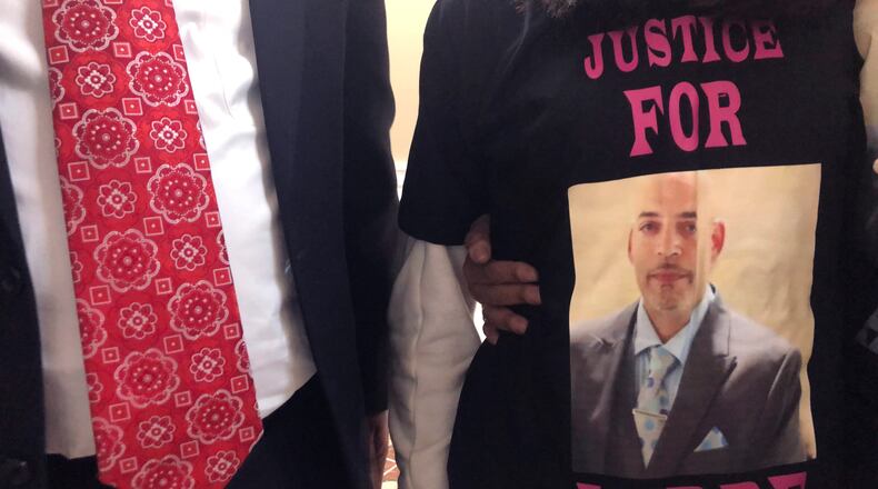 Andre Hill, fatally shot by Columbus police on Dec. 22, is memorialized on a shirt worn by his daughter, Karissa Hill, on Thursday, Dec. 31, 2020, in Columbus, Ohio. Karissa Hill said she considered her father an “everything man” because he did so many things. (AP Photo/Andrew Welsh-Huggins)