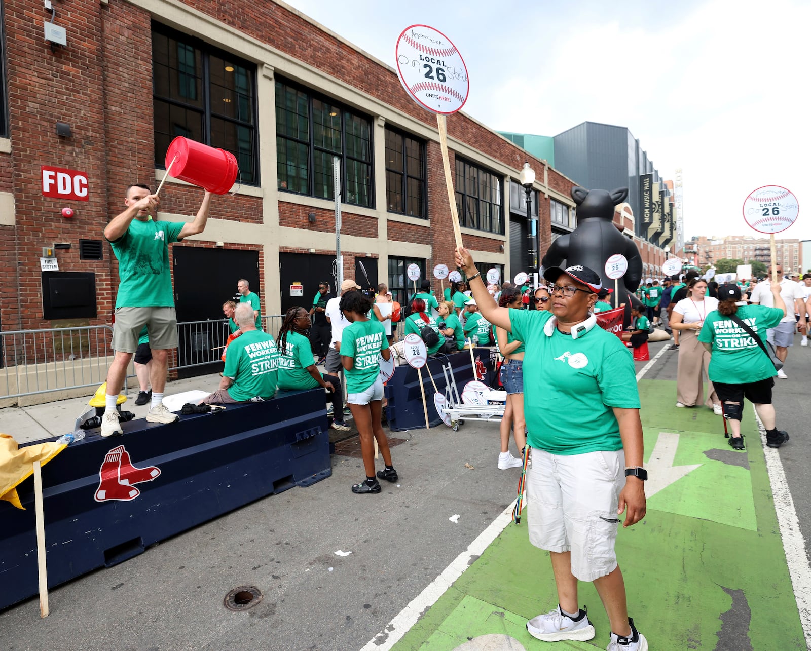 Concession workers from Fenway Park picket outside the ballpark Friday, July 25, 2025, in Boston before a baseball game between the Boston Red Sox and the Los Angeles Dodgers. (AP Photo/Mark Stockwell)