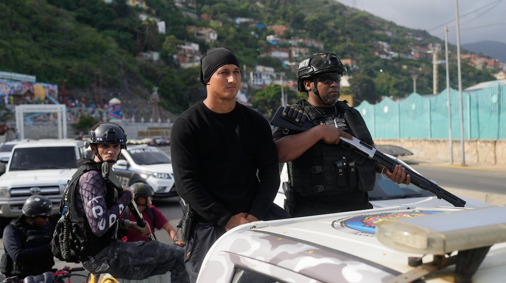 Police patrol in La Guaira, Venezuela, Saturday, Jan. 3, 2026, after U.S. President Donald Trump announced that President Nicolás Maduro had been captured and flown out of the country. (AP Photo/Matias Delacroix)