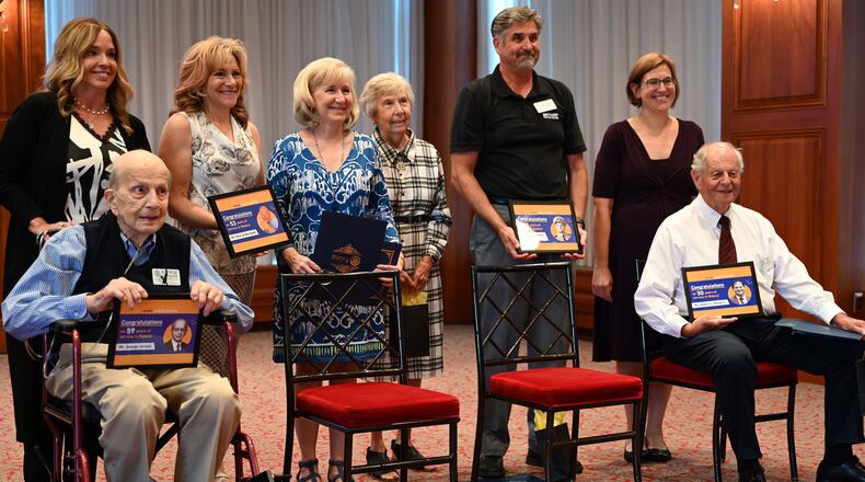 Four Hamilton Rotarians were honored at the Sept. 5, 2024, meeting for service of at least 50 years. George Jonson, 90, seat at left, had been with the Hamilton Rotary for 59 years. Bob Weigel, 77, seat at right, has been a part of the club for 50 years. Also honored was Richard Underwood, 95, was honored for his 53 years of service. He was not able to attend the meeting. Ricardo Bethart, who passed away in August at 92 years old, had served with the club for 50 years. Underwood and Bethart's families accepted the recognition on their behalves. MICHAEL D. PITMAN/STAFF