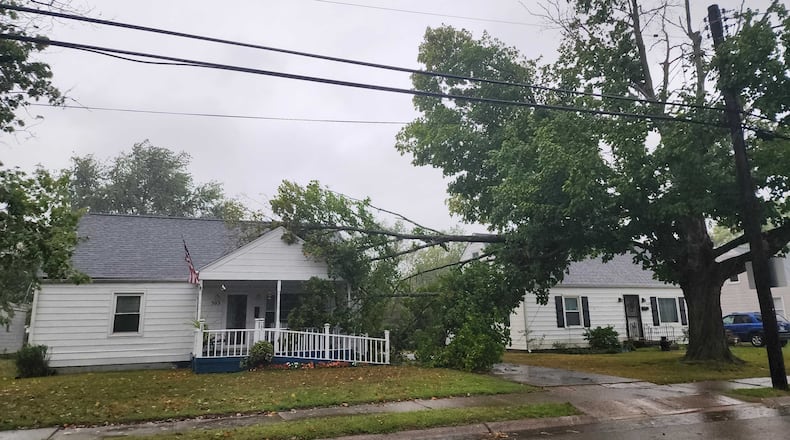 Several large branches of a tree fell onto a house in Trenton as heavy rain and high wind from the remnants of Hurricane Helene moved through the area Friday, Sept. 27, 2024. NICK GRAHAM/STAFF