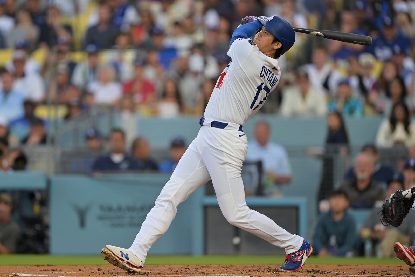 Los Angeles Dodgers' Shohei Ohtani hits a two-run home run during the first inning of a baseball game against the Minnesota Twins in Los Angeles, Monday, July 21, 2025. (AP Photo/Jayne Kamin-Oncea)