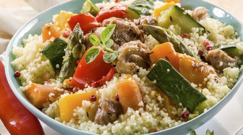 Fish in a Pouch with Garlic Couscous. LINDA GASSENHEIMER/TRIBUNE NEWS SERVICE