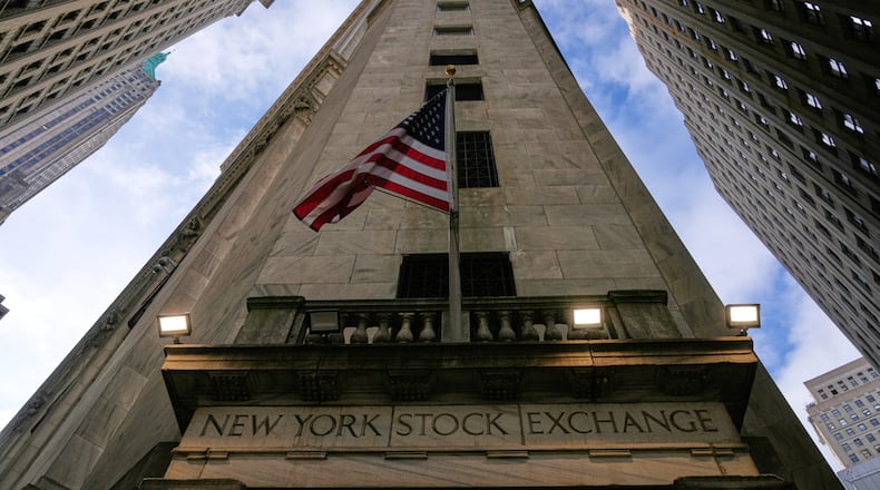 An American flag is displayed over an entrance to the New York Stock Exchange in New York, Thursday, Feb. 12, 2026. (AP Photo/Seth Wenig)