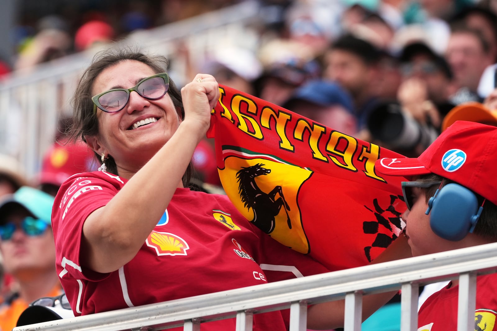 A fan cheers during the qualifying session for the Formula One Miami Grand Prix auto race, Saturday, May 3, 2025, in Miami Gardens, Fla. (AP Photo/Marta Lavandier)