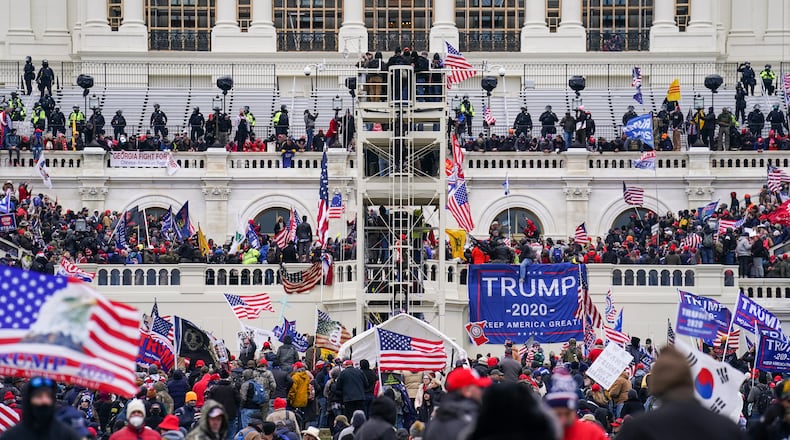 FILE - Insurrectionists loyal to President Donald Trump breach the Capitol in Washington, Jan. 6, 2021. (AP Photo/John Minchillo, File)