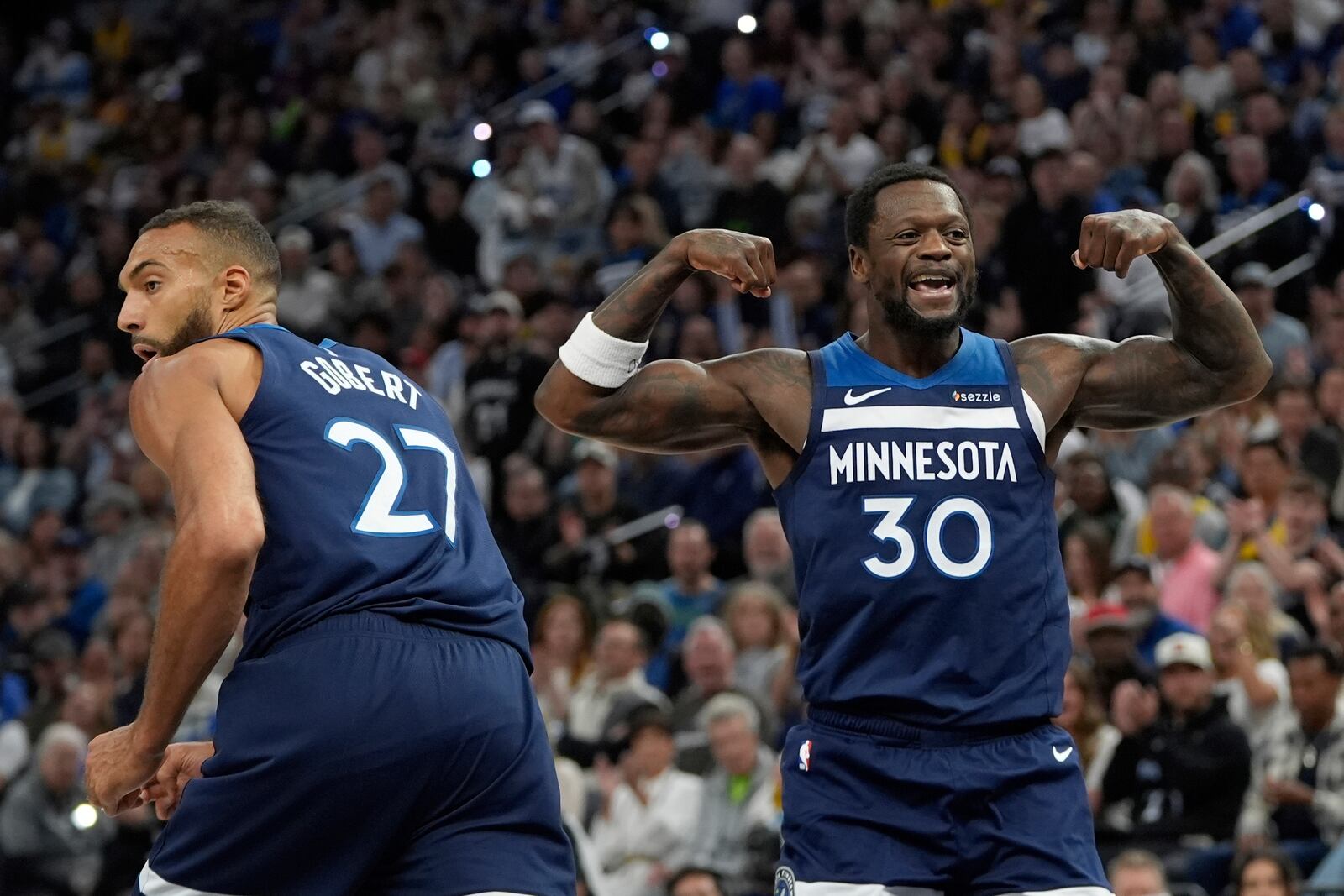 Minnesota Timberwolves forward Julius Randle (30) celebrates after a dunk during the first half of Game 4 of an NBA basketball first-round playoff series against the Los Angeles Lakers, Sunday, April 27, 2025, in Minneapolis. (AP Photo/Abbie Parr)