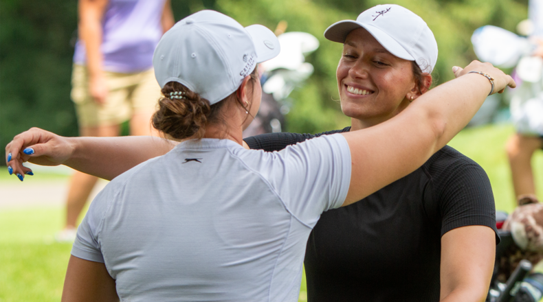 Former Lakota East standout Ellie Yeazell embraces her sister Clare after finishing with a 69 Wednesday at the U.S. Women's Amateur qualifier at Walnut Grove Country Club. Yeazell qualified for next month's national tournament in Oregon. JEFF GILBERT/CONTRIBUTED