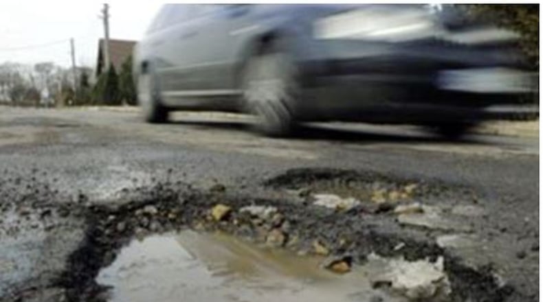 Damage from hitting potholes is why motorists need to watch for three warning signs to help determine if their vehicle has been damaged. File photo