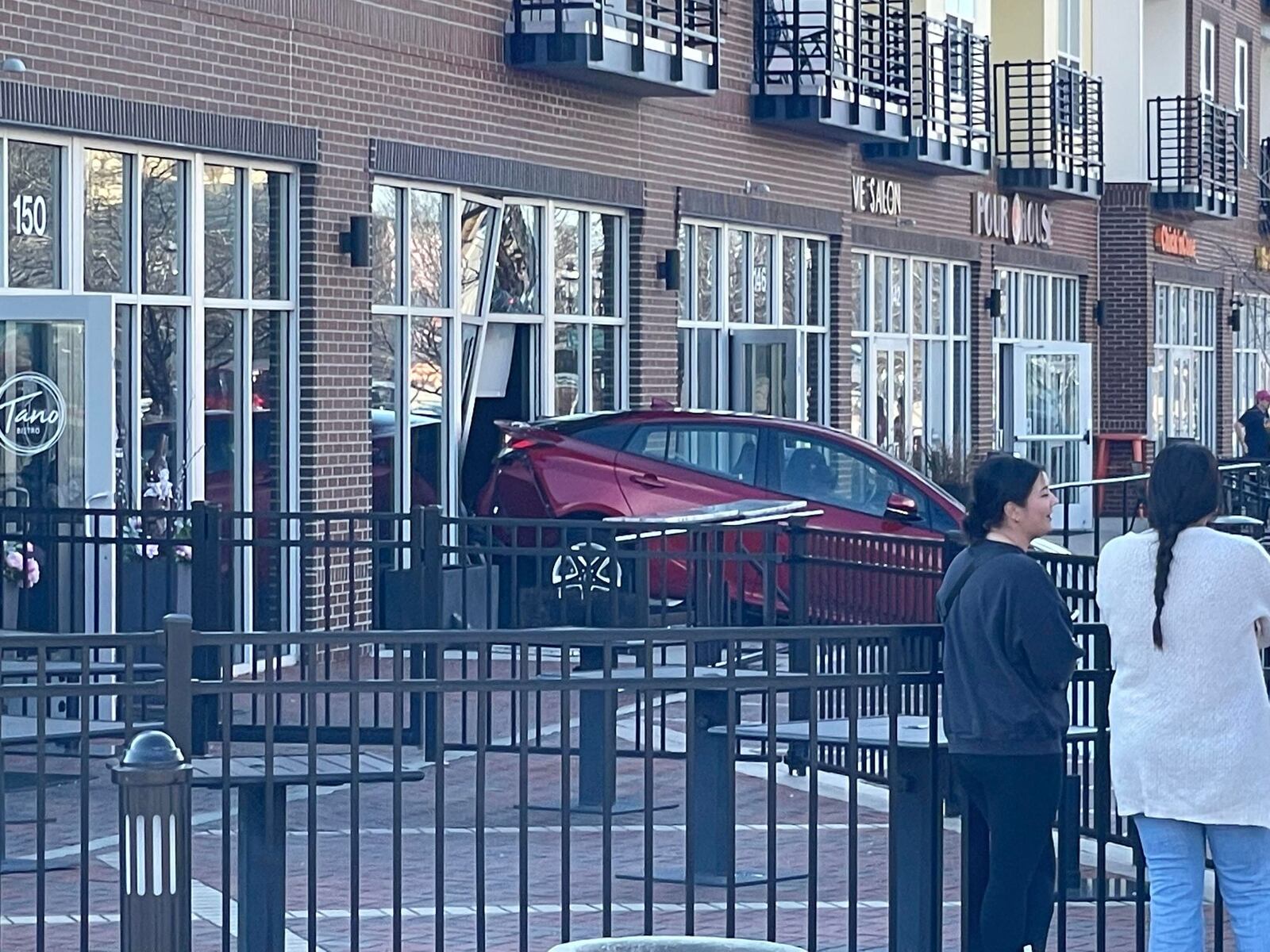 Around 10:30 a.m. Sunday, a driver backed their vehicle into the windows of Tano Bistro on Riverfront Plaza in Hamilton. CONTRIBUTED/RODNEY OWENS