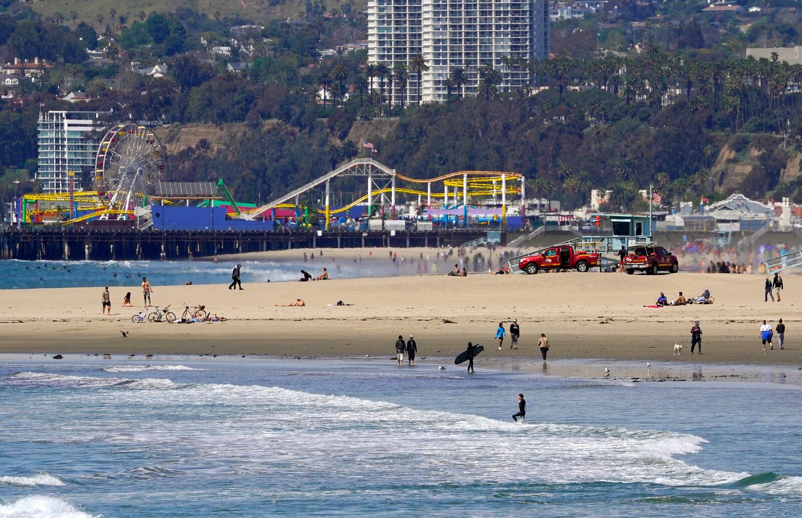 FILE - Beachgoers are seen at Venice Beach, Saturday, March 21, 2020, in Los Angeles. (AP Photo/Mark J. Terrill, File)