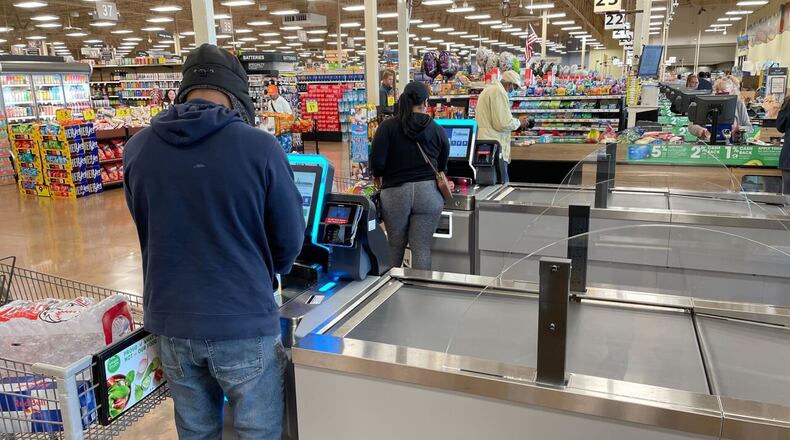 Shoppers at an area Kroger are seen checking out. WCPO/CONTRIBUTED