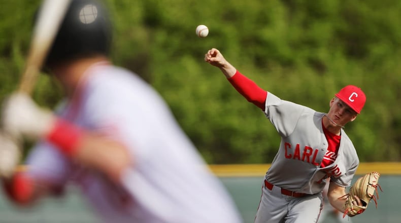 Carlisle's Brendon Rowe sends a pitch to the plate during their game against Madison on Monday, April 21, 2025. The Indians won 8-1. The game was held as part of the Reds Futures High School Showcase at the Reds Urban Youth Academy. Nick Graham/STAFF