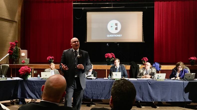 Hamilton Schools Superintendent Mike Holbrook makes a special presentation before the school board’s meeting this week on the negatives of EdChoice vouchers on his district. “This is an urgent matter. It’s going to impact Hamilton Schools for the next decade if not longer,” Holbrook told the board meeting audience Thursday night at Garfield Middle School. He is one of many area school leaders sharply criticizing the EdChoice program’s expansion by the state. (Photo By Michael D. Clark/Journal-News)