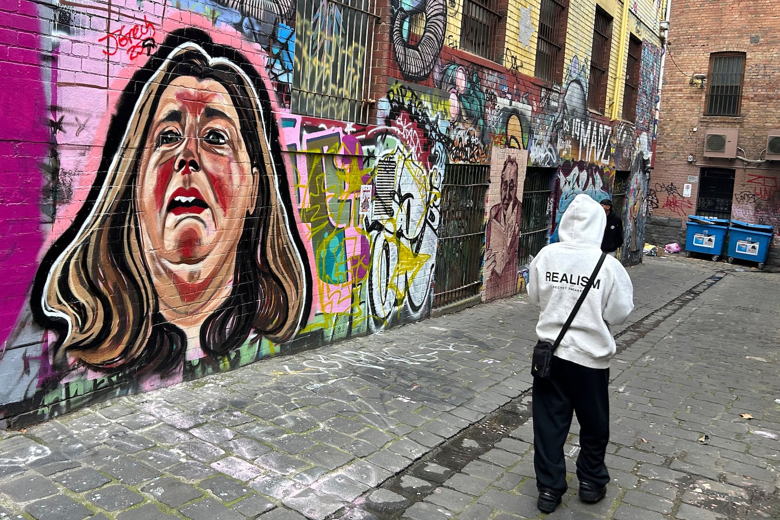 A likeness of Erin Patterson is painted on a wall in Melbourne, Australia, on June 28, 2025. (AP Photo/Rod McGuirk)