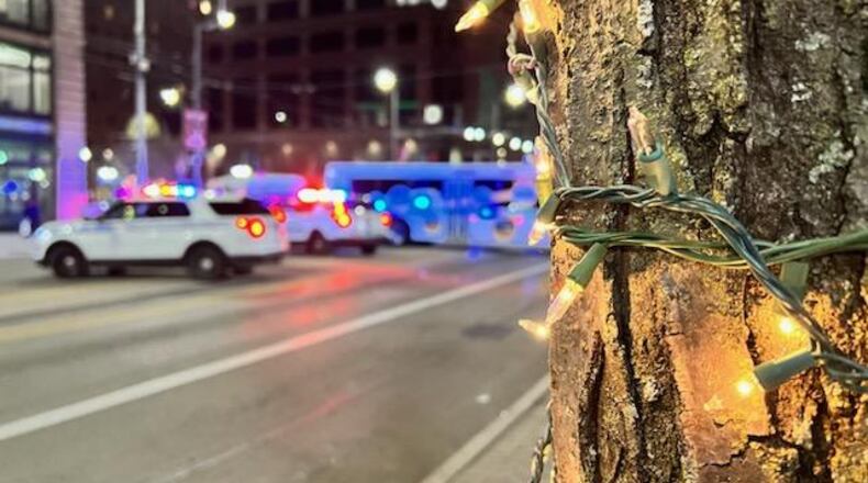 The parade at the Dayton Holiday Festival was stopped Friday night after a shot was fired. Tom Gilliam/Contributed.