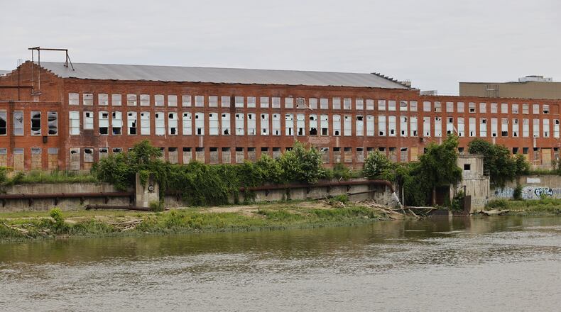 Historic-replica windows soon will begin filling in spaces in the massive walls of the former Champion Paper mill, being transformed into Spooky Nook Sports Champion Mill. Nick Graham/STAFF