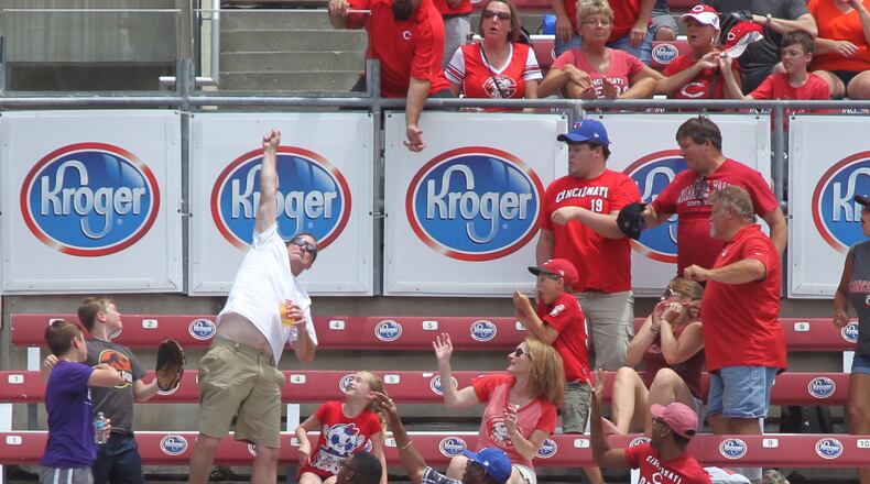 A fan tries to catch a home run hit by the Dodgers. David Jablonski/Staff