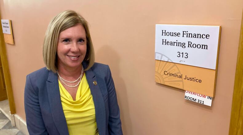 State Rep. Cindy Abrams, a Cincinnati Republican and former police officer, stands outside the Statehouse hearing room where her bill increasing punishments against violent protesters was approved on Wednesday, Nov. 10, 2021, in Columbus, Ohio. Abrams called the measure, approved by the GOP-controlled House Criminal Justice Committee along party lines, common sense legislation that supports people's right to peacefully assemble while punishing lawbreakers. (AP Photo/Andrew Welsh-Huggins)