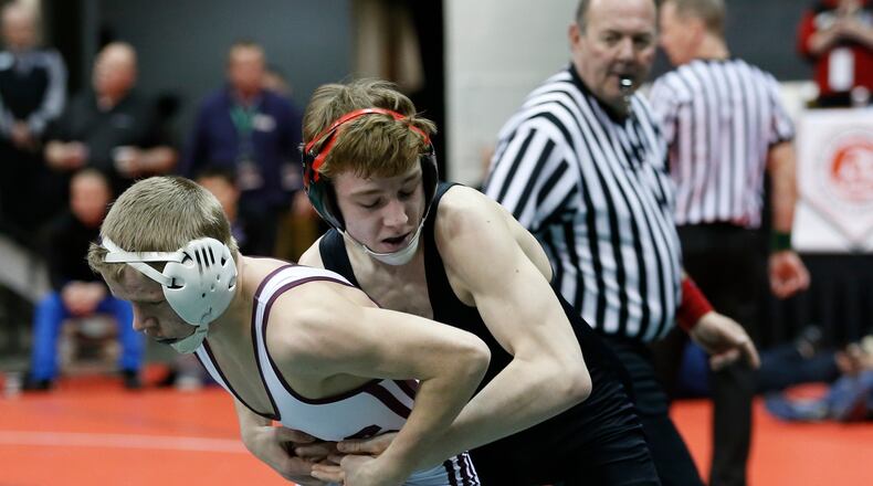 Jacob Johnson of Plain City Jonathan Alder (black) wrestles Jake Gentry of Ross (white) in a 113-pound match March 3 during the Division II state tournament at the Schottenstein Center in Columbus. BARBARA J. PERENIC/COLUMBUS DISPATCH