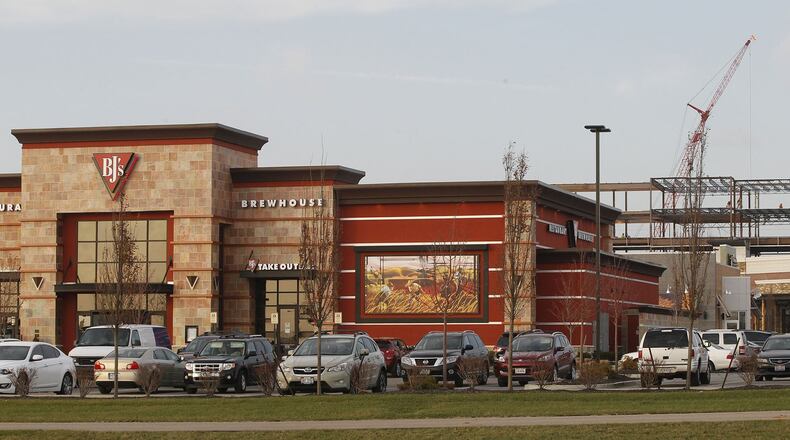 Miami Twp.’s Austin Landing is one of the major mixed retail and office developments expanding between Cincinnati and Dayton. TY GREENLEES / STAFF