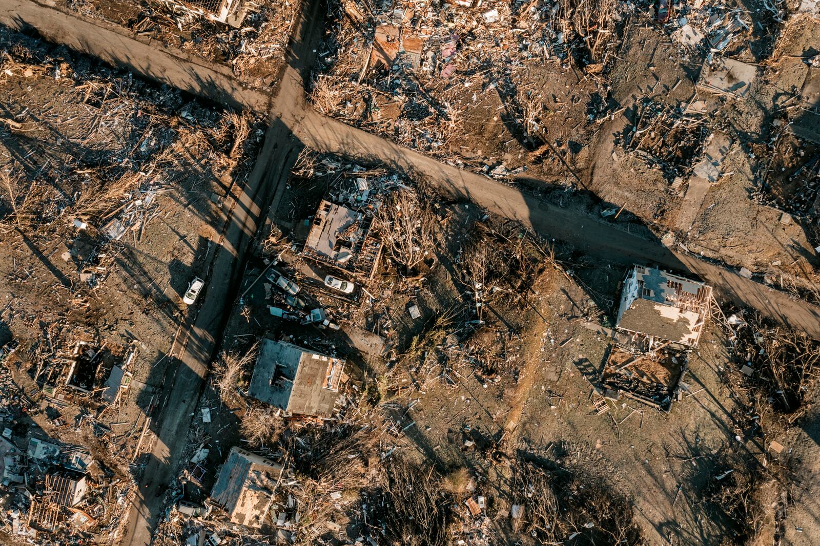A heavily damaged neighborhood in Dawson Springs, Ky., on Monday, Dec. 13, 2021, where a tornado flattened much of the town on Friday night. After grimly fluctuating death tolls since Friday’s devastating swarm of tornadoes, Gov. Andy Beshear of Kentucky said on Monday that there were 64 confirmed deaths in the state, though he expected that number to rise as crews continued to search through the ruins. (William Widmer/The New York Times)