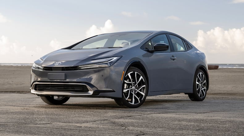This photo provided by Toyota shows the Prius Plug-in Hybrid, an affordable and surprisingly sporty plug-in hybrid with excellent fuel economy. (Nathan Leach-Proffer/Toyota Motor Sales U.S.A. via AP)