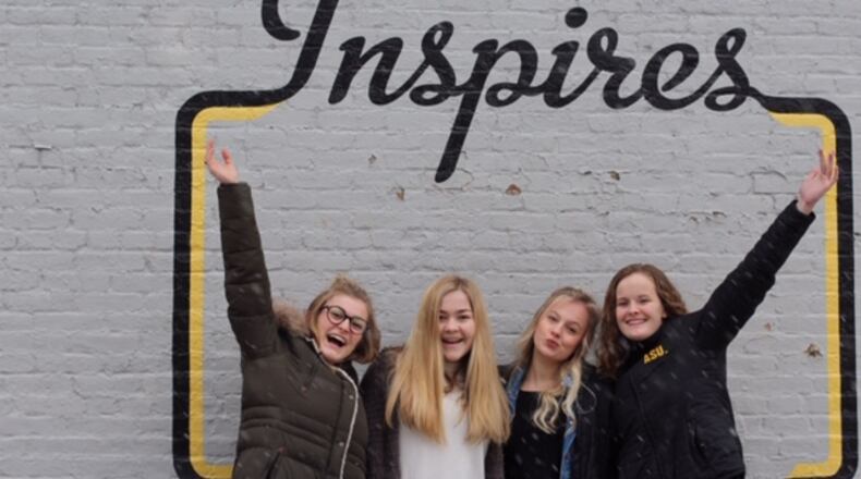 Oakwood High School sophomores ( left to right) Ryann Mescher, Dana Clark , Zoe Waller and Claire Parker launched the Femme Aid Collaborative to address period poverty in the Dayton area. They are pictured in the Oregon District.