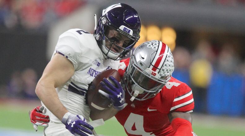 Ohio State’s Jordan Fuller tackles Northwestern’s Flynn Nagel in the Big Ten Championship on Saturday, Dec. 1, 2018, at Lucas Oil Stadium in Indianapolis. David Jablonski/Staff